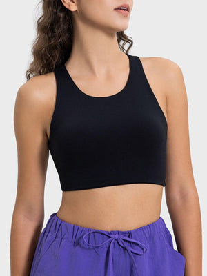 Woman modeling a sleek black Millennia Cutout Round Neck Active Tank, perfect for stylish workouts and comfortable movement.