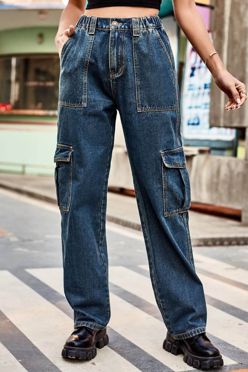 Woman wearing Baeful Long Straight Leg Jeans with pockets, displaying a casual and chic style on an urban street background.