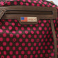 Close-up of Nicole Lee USA tote bag interior with pink polka dots and logo patch.