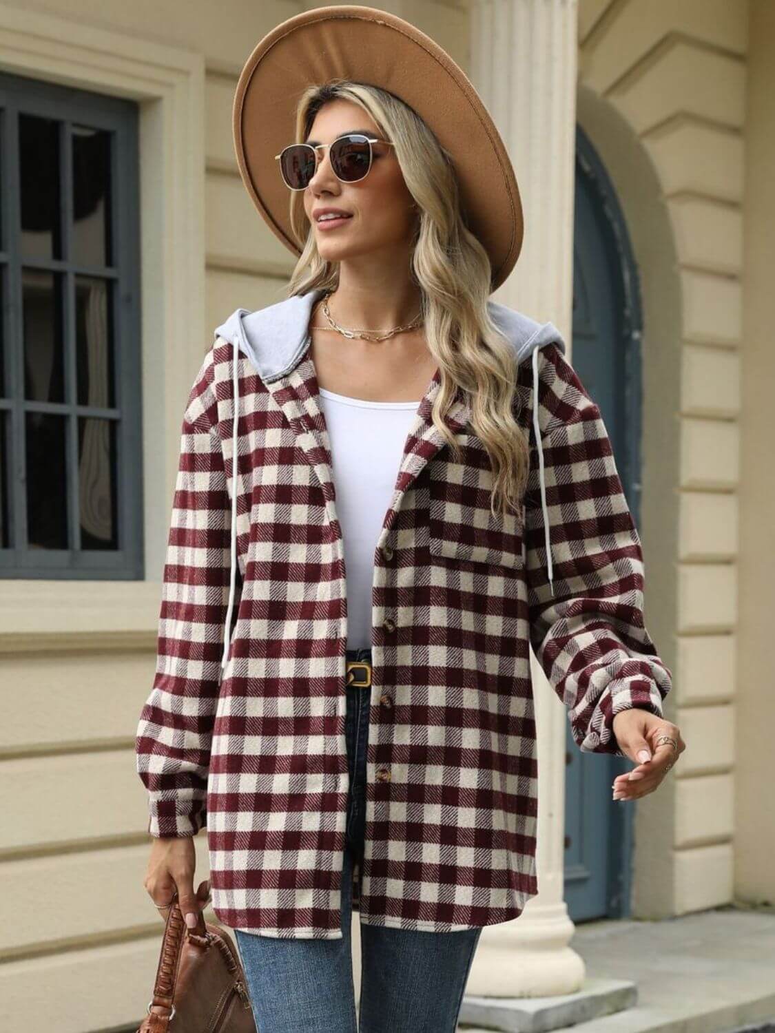 Woman wearing Bella Road Drawstring Plaid Long Sleeve Hooded Jacket, standing outdoors in stylish casual outfit.