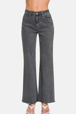 Acid washed frayed hem bootcut jeans for a trendy, vintage look and flattering silhouette. Perfect for casual outfits!