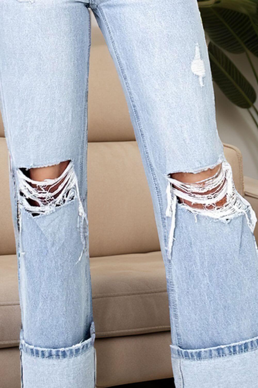 Close-up of Distressed High Waist Jeans with Pockets, featuring a stylish ripped design, perfect for a trendy casual look.