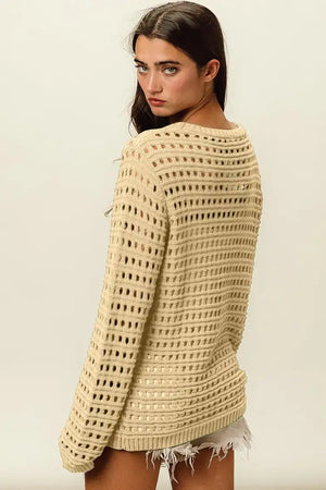 Woman wearing a Round Neck Openwork Knit Cover Up in beige, showcasing the stylish back design and texture, perfect for layering over outfits.