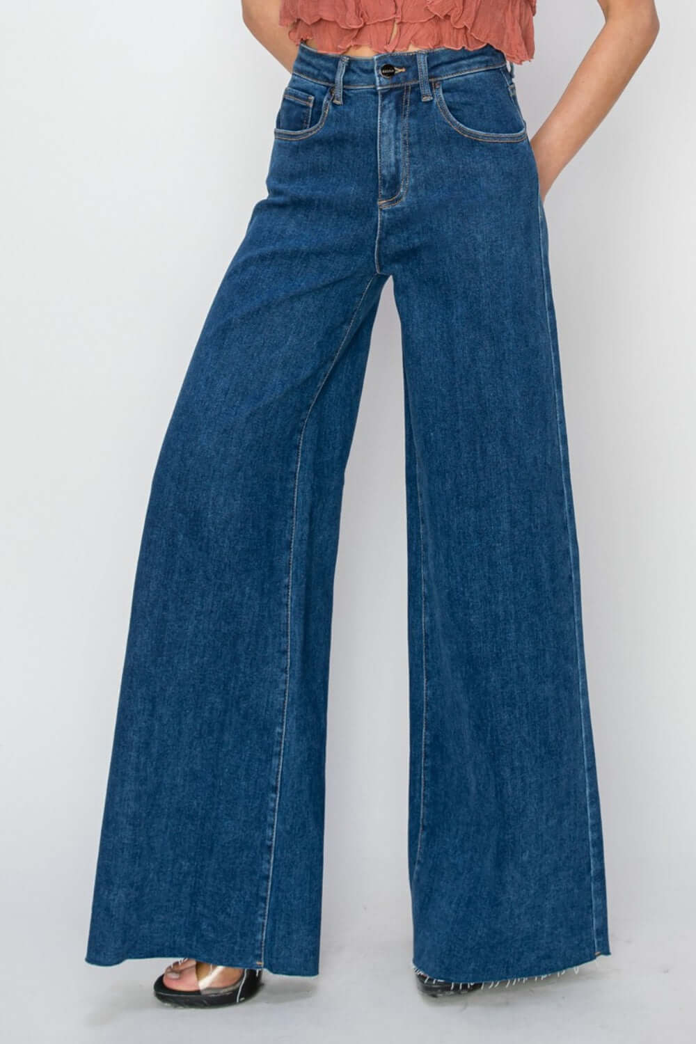 High rise palazzo jeans from Risen Jeans featuring a wide-legged silhouette and high-waisted fit for a flattering, modern look