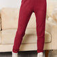 Ribbed burgundy pants and notched long sleeve top set with white ankle boots, polyester and elastane, machine washable