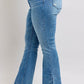 Side view of Judy Blue high waist tummy control vintage wash slim bootcut jeans with trendy side slits.