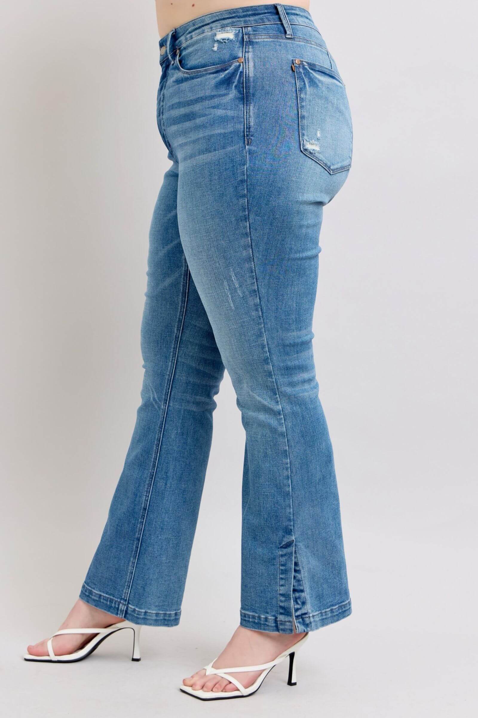 Side view of Judy Blue high waist tummy control vintage wash slim bootcut jeans with trendy side slits.