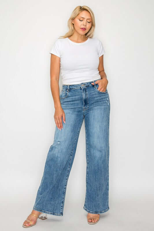 Model wearing bytos high rise wide leg jeans with pockets, showcasing a stylish and comfortable denim look.