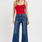 Model wearing RISEN tummy control bootcut plus size jeans, featuring a flattering waistline and stylish flare.