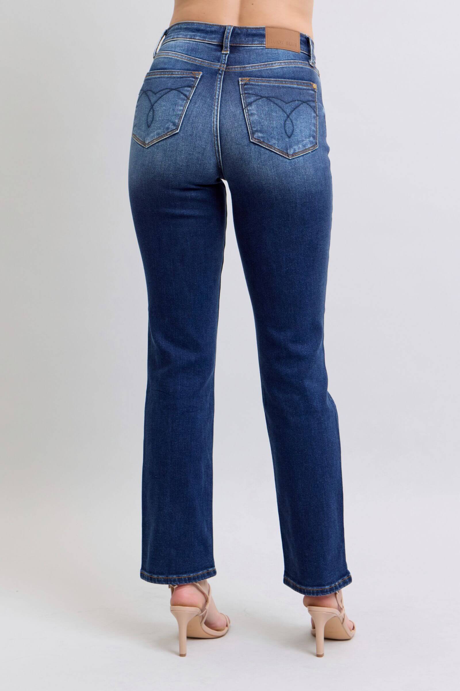 Back view of Judy Blue washed straight leg jeans with pockets, showcasing a flattering fit and stylish design.