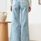 Back view of Distressed Frayed Hem Flare Jeans with trendy ripped design, frayed hems, and classic 5-pocket style.