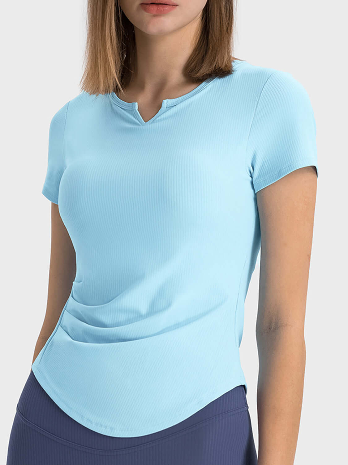 Millennia Notched Short Sleeve Active T-Shirt in light blue, featuring a trendy notched neckline and comfortable fit.