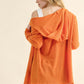 Woman wearing orange thermal hooded open front cardigan with pockets, showing back view with casual style and cozy fabric.