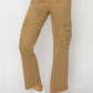 Tan high-rise cargo jeans for petites by Risen Jeans with utilitarian cargo pockets, paired with white sneakers