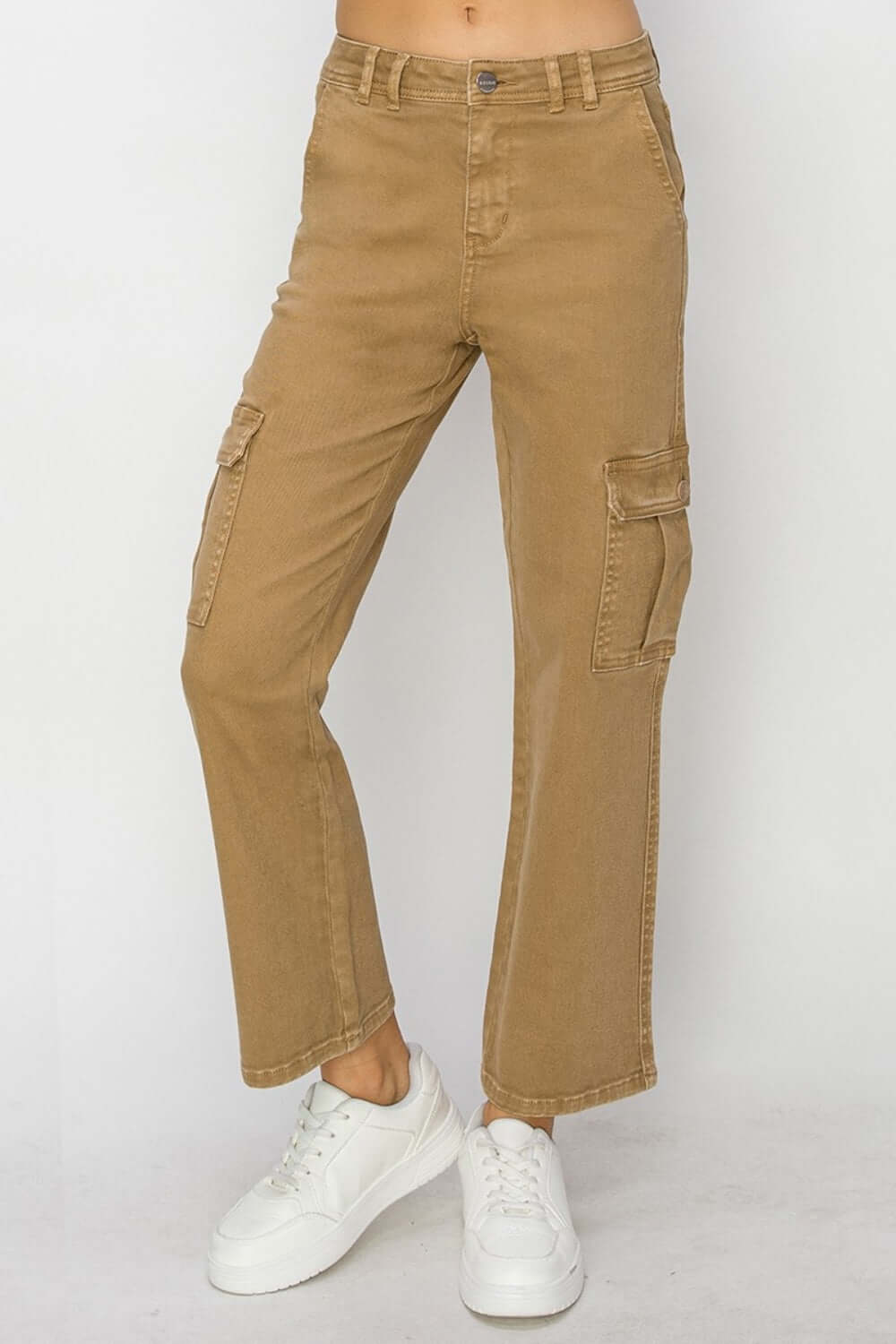 Tan high-rise cargo jeans for petites by Risen Jeans with utilitarian cargo pockets, paired with white sneakers