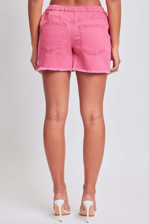 Back view of a person wearing pink drawstring raw hem shorts from YMI Jeans, showcasing trendy casual style and comfortable design.