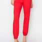 Red high-waisted jogger jeans showcasing relaxed fit and flattering style.