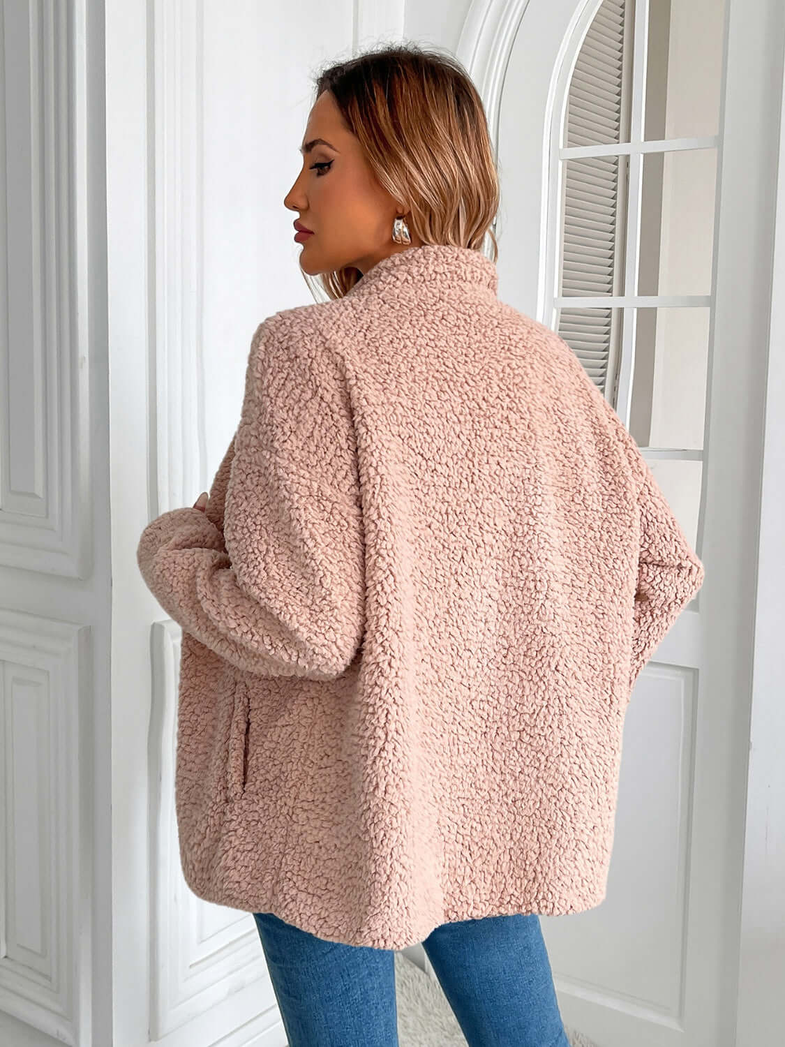 Woman wearing Ivy Lane fuzzy jacket in Watermelon Pink, showing the cozy texture and stylish fit, perfect for chilly days.