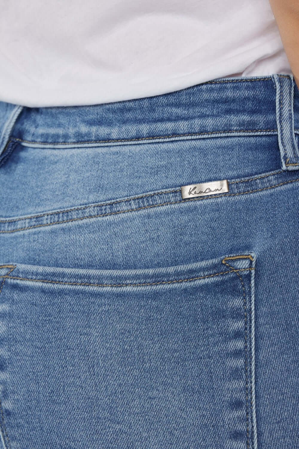 Close-up of Cat's Whiskers High Waist Jeans showcasing back pocket design and denim detail.