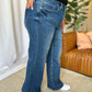 Woman wearing high rise tummy control wide leg jeans with a relaxed fit and comfortable silhouette