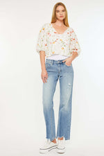 Kancan Mid Rise Frayed Hem Straight Jeans in medium wash paired with floral top, showcasing a trendy yet casual look.