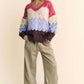 Model wearing Davi & Dani Wavy Texture Color Block V-Neck Sweater with wide-leg pants for a stylish fall look.