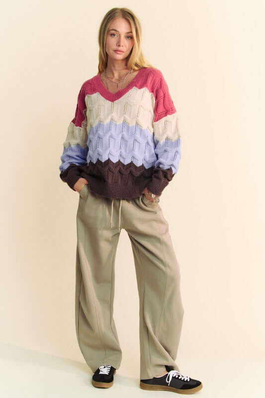 Model wearing Davi & Dani Wavy Texture Color Block V-Neck Sweater with wide-leg pants for a stylish fall look.