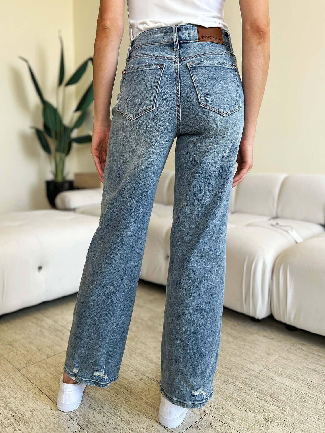 Back view of High Waist Distressed Straight Judy Blue Jeans showing flattering fit and distressed detailing.