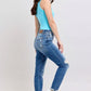 Model showcases Judy Blue Plus Size Distressed Jeans with Pockets, featuring a chic look and button fly design.