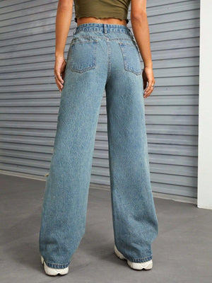 Woman wearing Bella Road Distressed Wide Leg Jeans with Pockets standing in front of a corrugated metal wall.