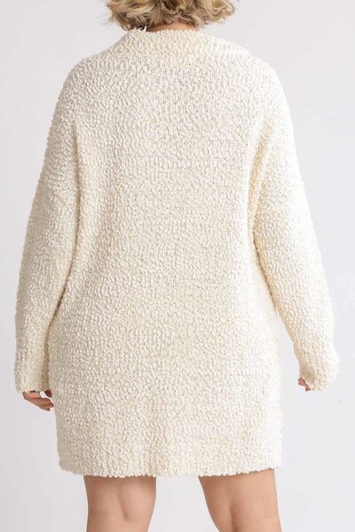 Back view of Umgee plus size high-low boucle sweater dress in cream, showcasing cozy texture and relaxed fit.