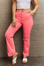 Woman wearing Kenya High Waist Side Twill Straight Jeans in vibrant pink, showcasing the flattering high-rise waist and stylish twill tape detail.