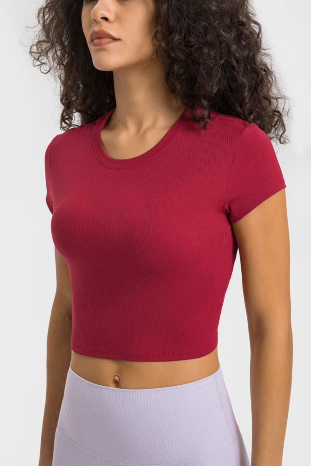 Millennia cropped sports t-shirt in vibrant red, perfect for yoga and fitness activities, featuring a stylish round neck design.