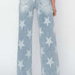 Back view of Risen Jeans full size raw hem star wide leg jeans with star embellishments and an edgy casual vibe.