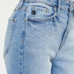 High Waist Raw Hem Straight Jeans - Close-up of high waistline with raw hem design in light denim color