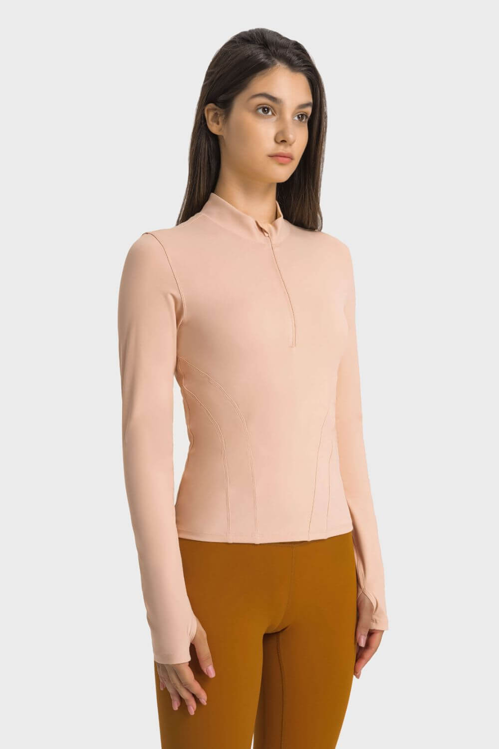 Millennia Half Zip Thumbhole Sleeve Sports Top in pink, perfect for workouts and yoga, featuring thumbholes and stylish design.