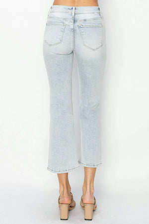 RISEN full size mid rise cropped flare jeans rear view in light wash denim highlighting trendy flare and modern cropped length