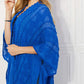 JUSTIN TAYLOR Pom-Pom Asymmetrical Poncho Cardigan in Blue at Bella Road