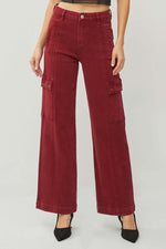 Risen high rise wide leg cargo jeans in deep red, featuring stylish pockets and modern design, paired with black heels for a chic look.