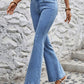 Woman wearing Bella Road High Waist Flare Jeans with Pockets in light wash, showcasing stylish retro look and moderate stretch.