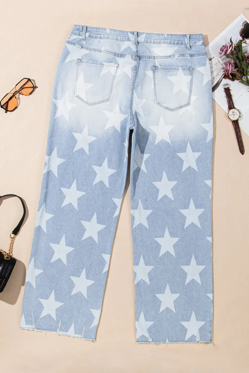 Bella Road Plus Size Star Straight Leg Jeans with Pockets, back view, denim with white star pattern, featured with accessories.