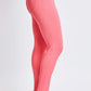 Side view of woman wearing Hyperstretch Mid-Rise Skinny Jeans in coral by YMI Jeans, showcasing slim fit and comfortable stretch fabric