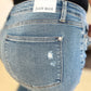 Back view of Judy Blue mid-rise distressed jeans with destroyed hem detailing