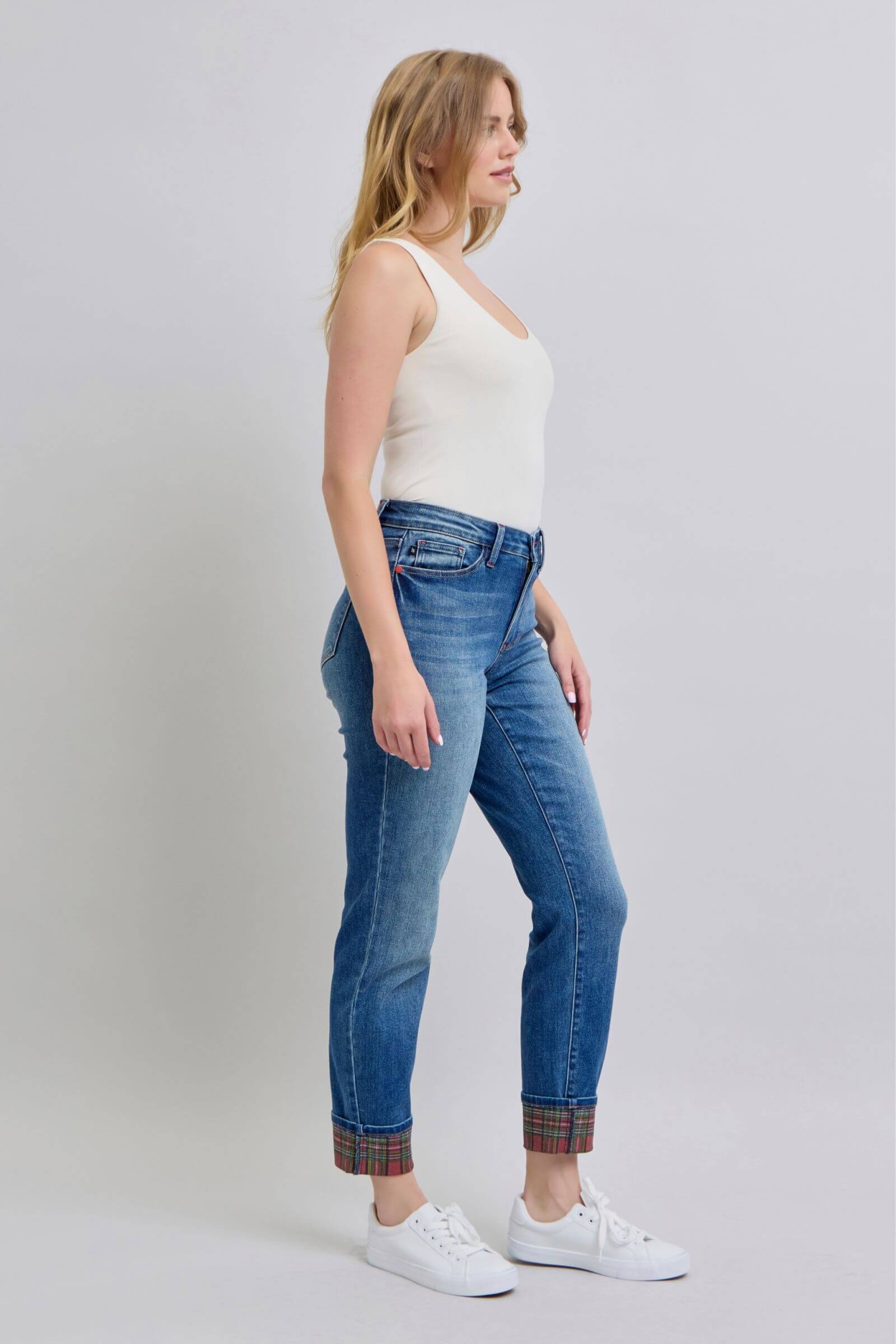 Model showcasing Judy Blue full-size plaid print cuff straight leg jeans with pockets, styled with a casual top and white sneakers.