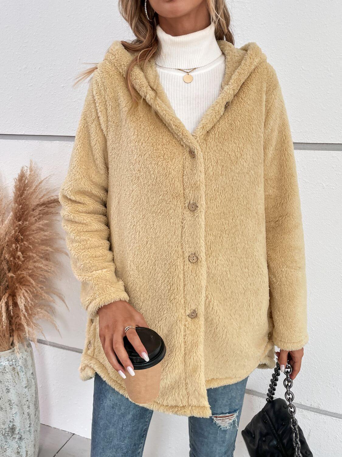 Woman wearing Bella Road Fuzzy Button Up Hooded Jacket in pastel yellow, holding a coffee cup, showcasing cozy fashion.