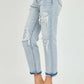 Mid-rise sequin patched jeans with distressed details and stylish sequin embellishments, modeled with clear high heels.