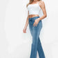 Model showcasing bytos Cat's Whiskers Mid Rise Bootcut Jeans paired with a cute white crop top, perfect for stylish outfits.