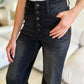 Woman wearing High Waist Button Fly Jeans, petite size, black denim, Judy Blue Jeans, flattering high waist design with button fly closure.