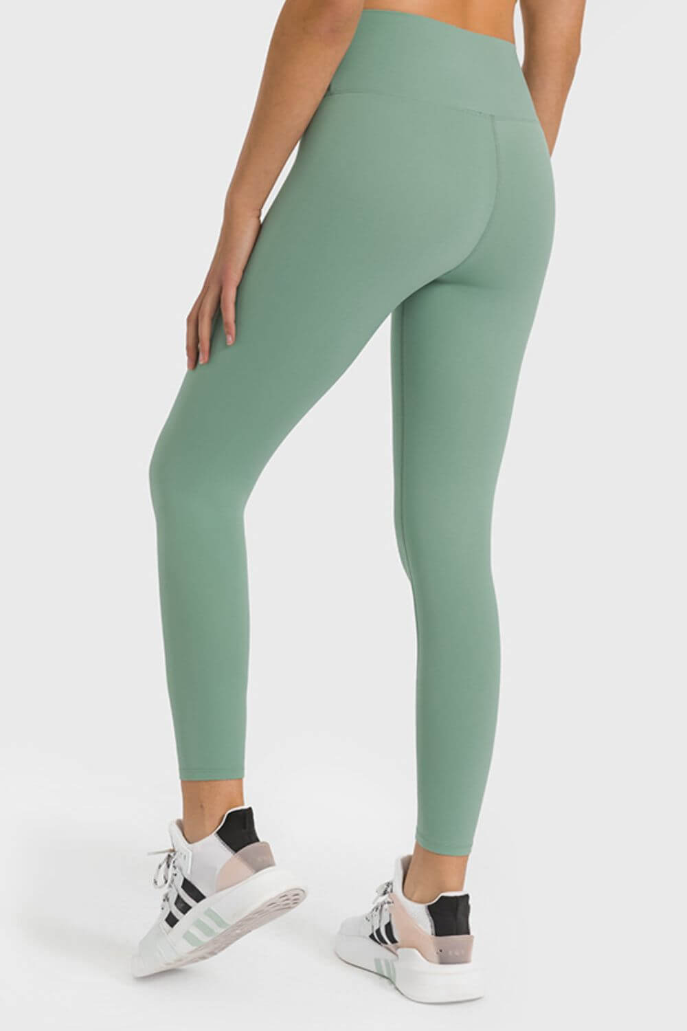 Millennia High Waist Ankle-Length Yoga Leggings in green, showcasing a comfortable fit for yoga and workouts.