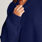 Close-up of a person wearing a navy blue, side slit, round neck, long sleeve sweater made of cotton and polyester blend.